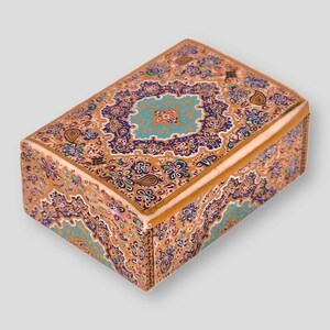 May include: A small wooden box with a decorative floral design in shades of blue, gold, and brown. The box is intricately painted with a paisley pattern.