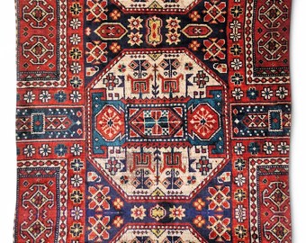 Cushion cover inspired by a traditional Persian rug design from the Qashqai tribe with geometric and floral motifs.