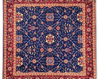 Cushion cover inspired by a traditional Persian rug design in the Isfahan style, in a dark blue tone with a reddish border.