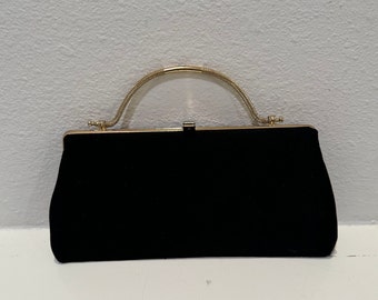 Vintage kleine schwarze Clutch-Geldbörse mit goldenem Akzentgriff