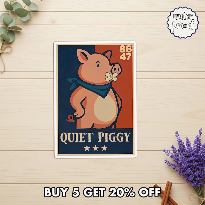 May include: A rectangular sticker featuring a cartoon pig with a bandage over its mouth and a blue bandana. The sticker has the words "QUIET PIGGY" and three stars. The background is split between navy blue and rust.