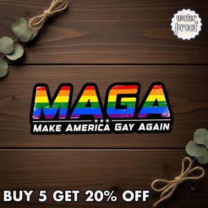 May include: A rainbow-colored sticker with the text "MAGA" in bold letters, with the phrase "MAKE AMERICA GAY AGAIN" below. The sticker has a black border and a "water proof" label. The background is a wooden surface.