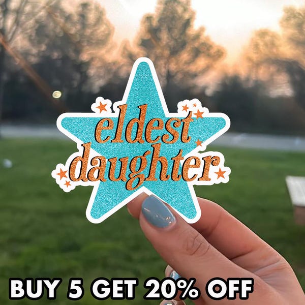 May include: A teal glitter star-shaped sticker with the words "eldest daughter" in orange script. The sticker has a white border and small orange star accents. The text "BUY 5 GET 20% OFF" is at the bottom.