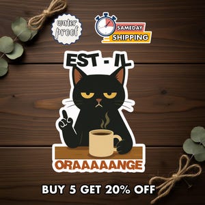 May include: A sticker featuring a grumpy black cat holding a coffee mug, with the text "EST-IL" above and "ORAAAAANGE" below. Additional stickers include "water proof" and "SAMEDAY SHIPPING".
