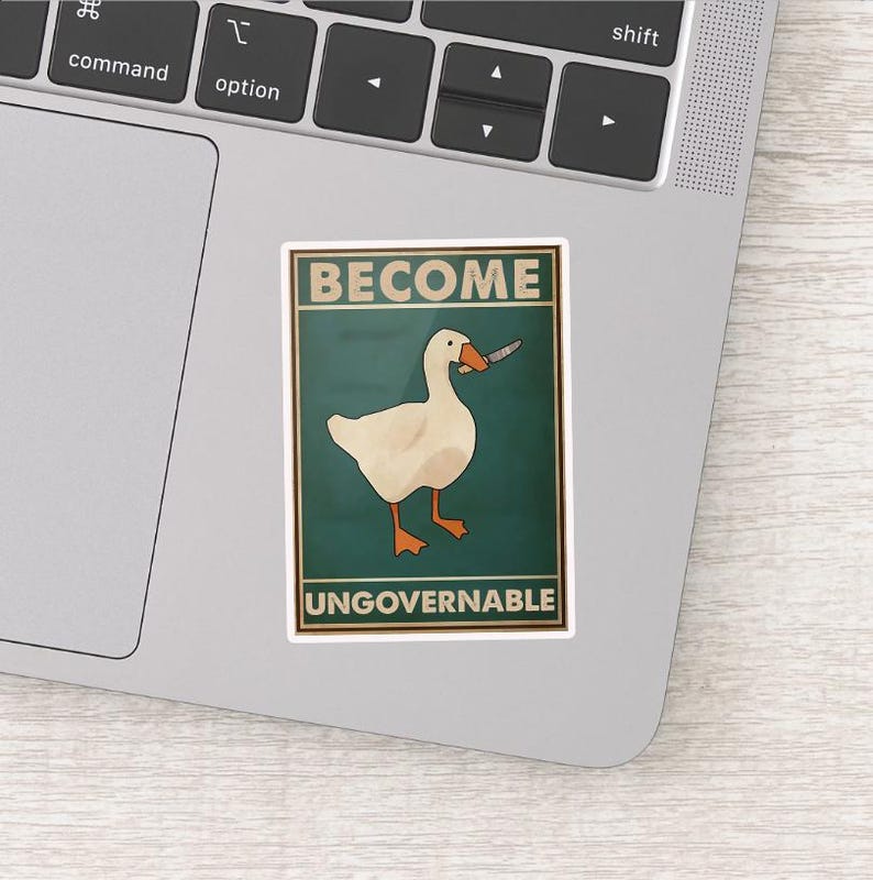 May include: A sticker featuring a white goose holding a knife, set against a teal background. The words "BECOME" and "UNGOVERNABLE" are printed above and below the goose in a vintage style.