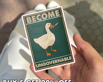 May include: A rectangular sticker featuring a white goose with an orange beak and feet, holding a knife in its beak. The sticker has the words "BECOME UNGOVERNABLE" and "BUY 5 GET 20% OFF" in a bold font.