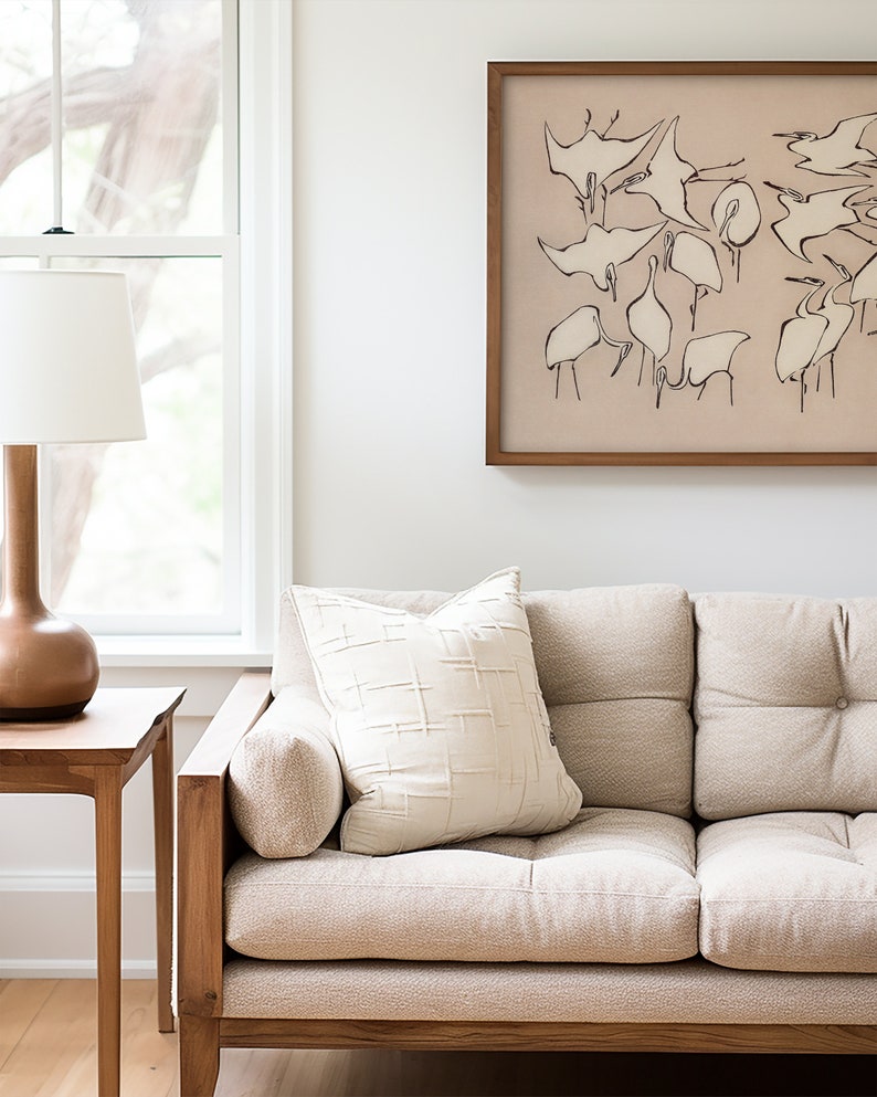 This vintage Japanese art print features a flock of egret birds rendered in bold, abstract brushstrokes, against an understated tan background.  A captivating addition to both traditional and modern interiors. Instantly download, print, and frame!