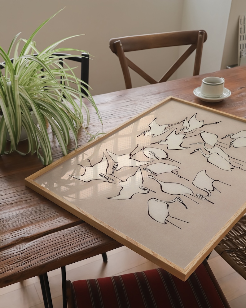 This vintage Japanese art print features a flock of egret birds rendered in bold, abstract brushstrokes, against an understated tan background.  A captivating addition to both traditional and modern interiors. Instantly download, print, and frame!