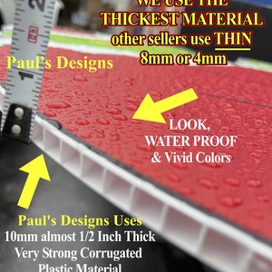 May include: Close-up of a red and white corrugated plastic sign with water droplets on the surface. The sign reads "Paul's Designs Uses 10mm almost 1/2 Inch Thick Very Strong Corrugated Plastic Material". The sign is being compared to a ruler, showing that it is thicker than other signs.