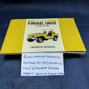 May include: A yellow and white Daihatsu 4 Wheel Drive owner's manual for F10, F10L, F20, and F20L models. The cover features a yellow illustration of the vehicle, the text Daihatsu 4 Wheel Drive, and the words Owner's Manual in black lettering.
