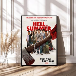 May include: A framed movie poster for "Hell of a Summer" with a black frame. The poster features a group of young people and an axe covered in blood. The text on the poster reads "A Bloody Fun Horror Throwback" and "Pack Your Body Bags".