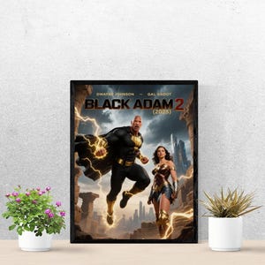 May include: A framed poster for the movie "Black Adam 2 (2025)" featuring Dwayne Johnson and Gal Gadot. The artwork depicts Black Adam in a black and gold suit with lightning effects, and Wonder Woman in her costume. The background shows a cityscape.