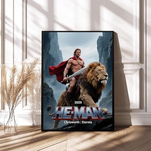May include: Framed poster featuring He-Man riding a lion, with the text "2025 HE-MAN Chrisworth | Eternia." The artwork depicts a muscular figure in a red cape and holding a sword, set against a mountainous backdrop.