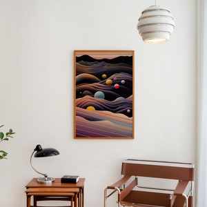 May include: A framed abstract print depicting a dark blue and purple landscape with colourful circles scattered throughout. The print is hanging on a white wall in a modern living room.