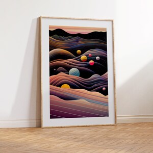 May include: Abstract art print featuring a landscape with colourful planets and a dark blue sky. The print is framed in a light wood frame.