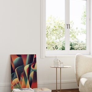 May include: A framed abstract art print with geometric shapes and colors in shades of red, orange, yellow, green, and blue. The print is hanging on a white wall next to a window. A small round side table with a glass top and a gold metal base is in front of the print. A stack of books is on the floor below the print.