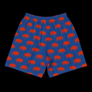K&ouml;nnte beinhalten: Blaue Sporthose mit einem sich wiederholenden Muster aus orangefarbenen B&uuml;ffelsilhouetten. Die Shorts haben einen elastischen Bund. Ideal f&uuml;r Sport oder Freizeit. Die Shorts sind etwa 40 cm lang.