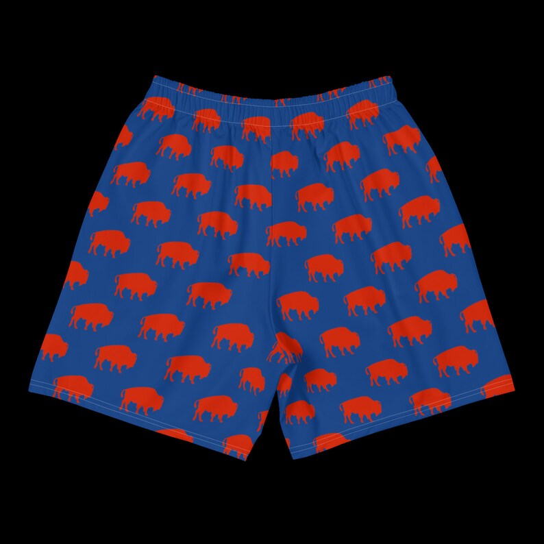 K&ouml;nnte beinhalten: Blaue Sporthose mit einem sich wiederholenden Muster aus orangefarbenen B&uuml;ffelsilhouetten. Die Shorts haben einen elastischen Bund. Ideal f&uuml;r Sport oder Freizeit. Die Shorts sind etwa 40 cm lang.