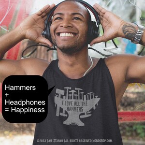 May include: A smiling person wearing black headphones and a black tank top with the text "I LOVE ALL THE HAMMERS" and a graphic of hammers. A speech bubble says "Hammers + Headphones = Happiness".