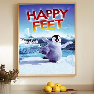 May include: A framed poster featuring the animated film "Happy Feet." The poster shows a cartoon penguin with its arms outstretched, standing on an iceberg. The title "Happy Feet" is displayed in large, red letters.