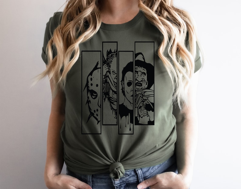 May include: A green t-shirt with a black graphic print of four horror movie characters. The characters are Jason Voorhees, Freddy Krueger, Michael Myers, and Leatherface.