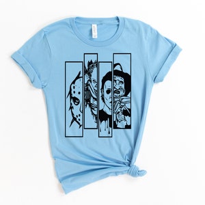 May include: Light blue t-shirt with a black graphic of four horror movie characters in a row. The characters are Jason Voorhees, Freddy Krueger, Michael Myers, and Leatherface.
