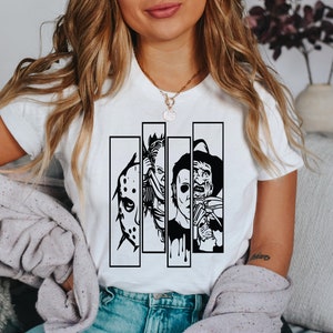 May include: White t-shirt with a black and white graphic print of four horror movie characters. The characters are Jason Voorhees, Freddy Krueger, Michael Myers, and Leatherface.