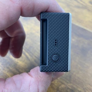 May include: A set of three ceramic mugs with a speckled, matte finish. The mugs are in shades of cream, light gray, and dark gray. Each mug has a simple, minimalist design, perfect for coffee or tea.