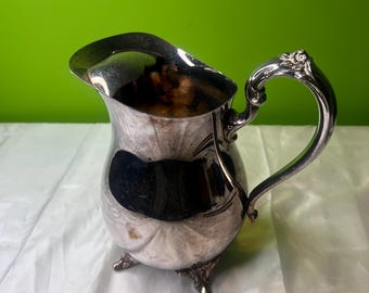 Vintage Oneida Silver Plated Water Pitcher with Ornate Design and Floral Embossed Handle