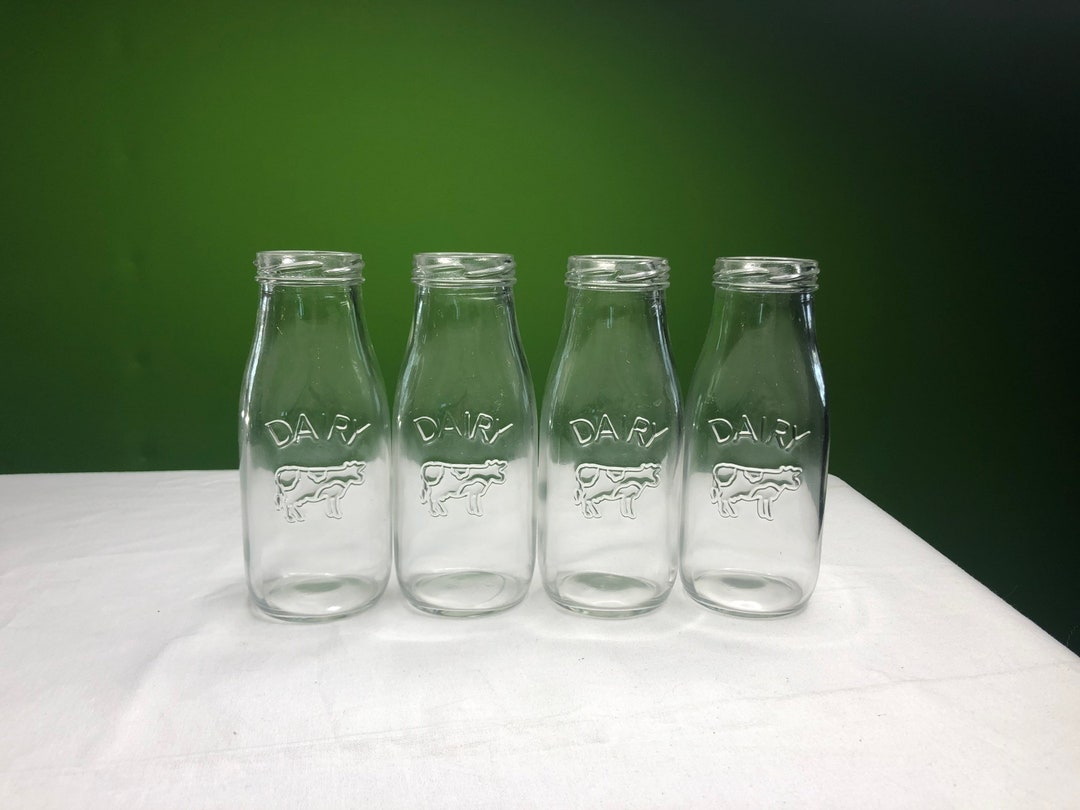 Vintage Heavy Clear Glass Dairy Bottles Set of 4 With Whimsical Cow and