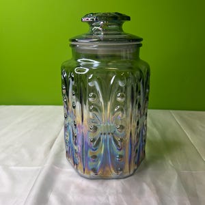 Tarro vintage con tapa, diseño hexagonal, color azul arcoíris iridiscente, años 70
