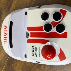 May include: A set of three ceramic mugs with a speckled, matte finish. The mugs are in shades of cream, light gray, and dark gray. Each mug has a simple, minimalist design and a rounded handle.