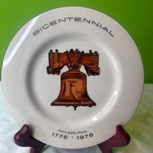 Vintage herdenkingsmunt Bicentennial 1776-1976 Liberty Bell porseleinen bord met gouden rand