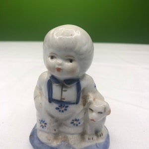 Vintage Porcelain Chub Boy with Puppy in Classic Blue and White coloring and beautiful gold accents