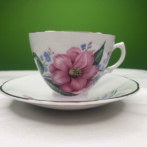 Vintage Fine Bone China Tea Cup and saucer with gorgeous pink Rose and light blue floral pattern and pry gold trim