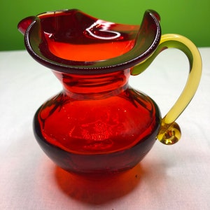 Vintage Ruby Glass Vase Pitcher Heavy Glass with attached Tangerine Handle and ruffle mouth for vase Gorgeous pony tail bottom hand blown
