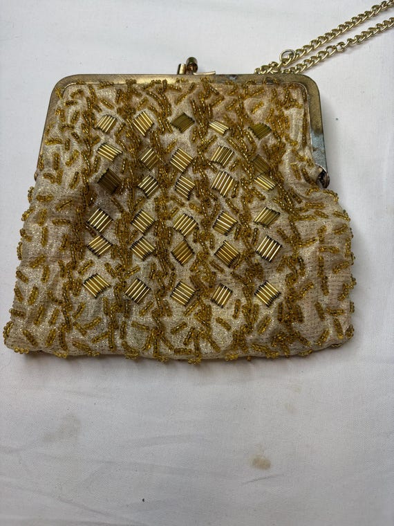 vintage Walborg gold beaded clutch purse, often featuring intricate needlepoint designs and a kiss lock closure.