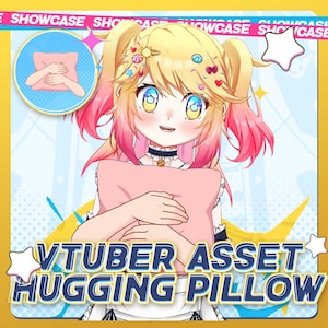 May include: A digital illustration of a smiling anime-style character with blonde and pink hair, holding a pink pillow. The image includes the text "VTUBER ASSET HUGGING PILLOW" in a yellow and blue design, with a "SHOWCASE" banner at the top.