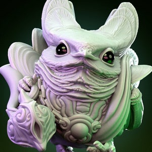 May include: A white ceramic figurine of a small, bird-like creature with large ears and a round body. The creature is wearing a decorative, layered garment and has large, black eyes.