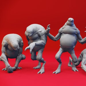 May include: Four gray, 3D printed, alien-like figures in various poses on a red background. The figures have large heads, short limbs, and bulbous bodies.