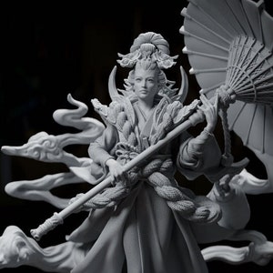 May include: A grey 3D printed figurine of a female figure in a flowing robe, holding a staff and an umbrella. The figure is standing on a cloud-like base with a swirling pattern.