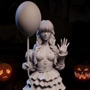 May include: A white painted figurine of a girl in a frilly dress holding a white balloon. She is standing on a round base with a textured surface. The figurine is surrounded by four lit jack-o'-lanterns with carved faces.