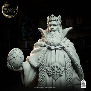 May include: A white statue of a king wearing a crown and holding a dragon egg. The king has a long beard and is wearing a robe with intricate detailing. The statue has the text "Dragons of Avendell" in the upper left corner.