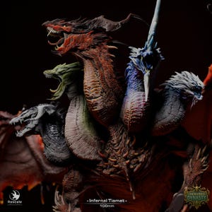May include: A multi-headed dragon figurine titled Infernal Tiamat 100mm, featuring five distinct heads in red, green, blue, black, and white. The creature has textured scales, sharp teeth, and visible wings against a dark background.