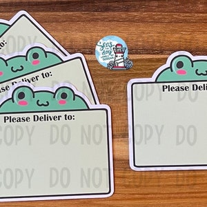 May include: Four green frog-themed gift tags with the text "Please Deliver to:" on each tag. The tags are on a wooden surface.