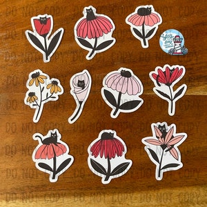 May include: Nine stickers featuring black cats on various flowers. The flowers include a red tulip, a pink flower with a yellow center, a white flower with a yellow center, a pink flower with a yellow center, a red flower with a yellow center, a pink flower with a yellow center, a pink flower with a yellow center, a red flower with a yellow center, and a pink flower with a yellow center.