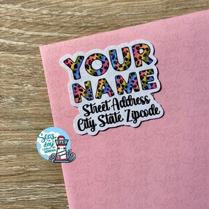 May include: A colorful sticker with a leopard print design that says "YOUR NAME" in large letters. Below the name, it says "Street Address City State Zipcode".
