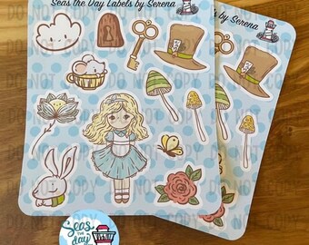 May include: A set of Alice in Wonderland themed stickers featuring a variety of characters and objects, including Alice, the Mad Hatter, a rabbit, a mushroom, a key, a teacup, and a cloud. The stickers are on a blue background with white polka dots. The text "Seas the Day Labels by Serena" is printed on the sticker sheet.