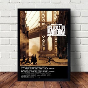 May include: A vintage film poster for the movie "Once Upon a Time in America" featuring a sepia-toned image of a bridge and a group of men walking down a street. The poster includes the film's title, the director's name, Sergio Leone, and the actors' names, including Robert De Niro, James Woods, and Elizabeth McGovern.