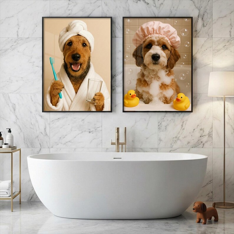 May include: Two framed wall art prints displayed above a white bathtub. The left print shows a brown dog in a white bathrobe and towel wrap holding a blue toothbrush and glass. The right print shows a brown and white dog in a pink shower cap.